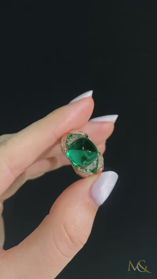 M&G Jewellery emerald sugarloaf men's ring shown in hand